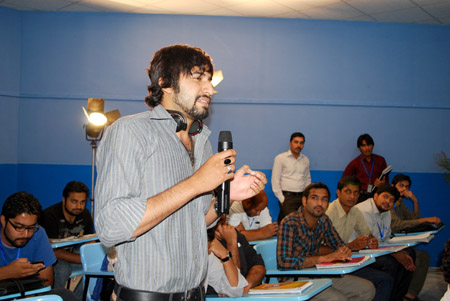 A student asks a question from the Sitara delegation